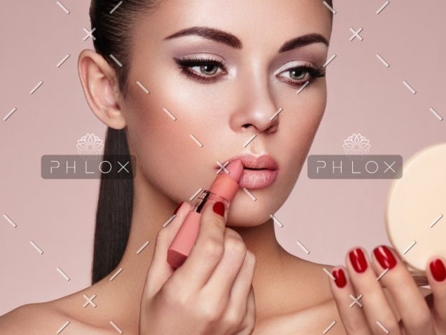 demo-attachment-551-beautiful-woman-paints-lips-with-lipstick-PMB6YWP-1